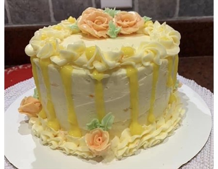 6” vanilla cake with mango filling and orange buttercream