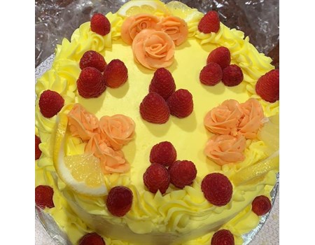 8” vanilla cake with raspberry filling, lemon buttercream and fresh raspberries